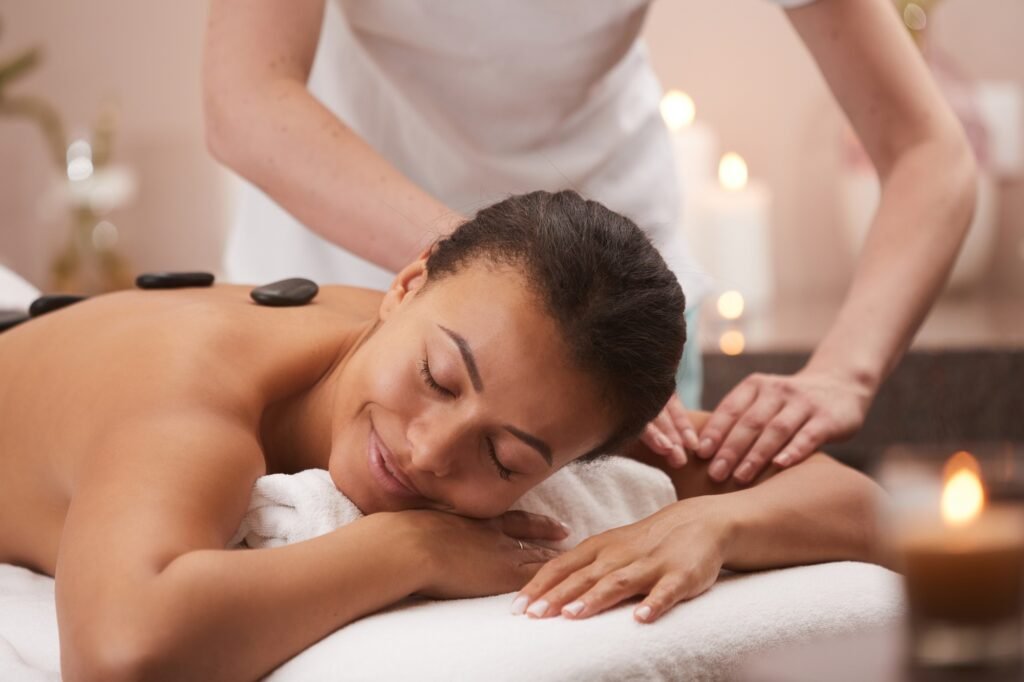 Woman Enjoying Stone Massage in Spa