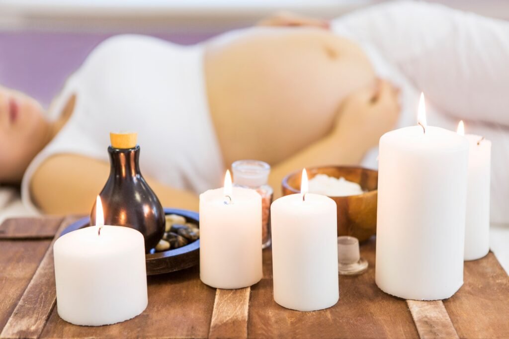 Young pregnant woman have massage treatment at spa